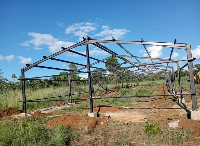 Steel portal frame being erected on site